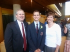 The graduate and his parents. Five down...one more to go!