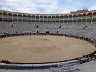 The cheap seats are in the sun and the expensive seats are in the shade. The actual event consists of three matadors with two bulls each.