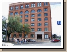 Here is a better shot of the building.  The famous window is on the far right -- second from the top.  The group crossing the street is our group.