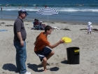 The guys playing a fun Frisbee game called Can Jam.