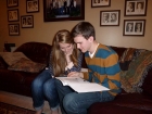 Elliot and Kelsey excitedly looking at all the information after the big announcement.