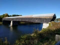Cornish Windsor Bridge at 460 feet is the largest two-span covered bridge in the world. It was built in 1866 at the cost of 9,000. On the front it says, "Walk your horses, or pay 2.00 fine."