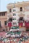 This shows the real deal in front of the police station in the Town Square. Pere is the policeman on top of the building clapping his hands together.