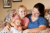 Emmy and her new brother Asher with their mom, Anne