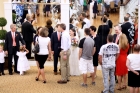 Greeting the guests at the reception. It was a big beautiful room with huge mirrors.