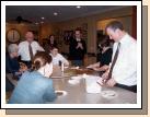 Everyone gathered around to have a piece of the cake.