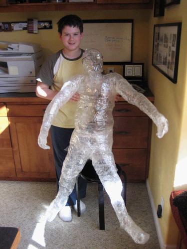 Clark made an installation piece in his art class -- a packing tape version of himself.  It is way cool.
