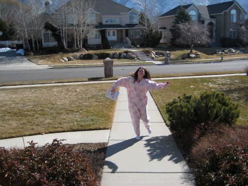 So Madeleine has a sleeper that she used for Halloween, but actually enjoyed sleeping in when it's really cold outside.  Even though she wasn't dressed, she decided to go out and get the mail -- silly girl!