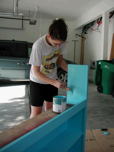 Madeleine giving an old headboard a new look for her new room.
