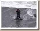 Quick!  Get off the rock before the next wave hits!