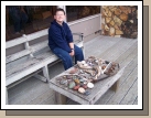 Clark showing off our collection of rocks, shells and driftwood.