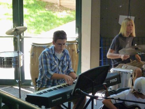 What do you think...should he grow out his hair like the drummer?