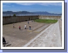 The recreation yard looking out from the building.  Alan is the little guy in a yellow shirt with a black backpack.