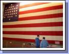 This is an actual size replica of the flag that was flown over Fort Sumter.  The real one is falling apart, but is rolled up and preserved in the long box below that has a window where you can see a piece of it.  Elliot and Clark are checking it out.