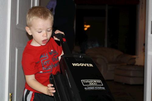 So back to Daniel's fascination with electronics that have cords and hoses -- his all time favorite things are vacuums and especially this hoover upright which he calls a "wee."  