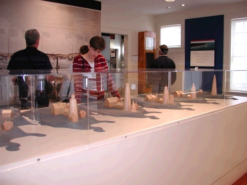 My friend Melora looking at a display of how the lighthouse changed throughout the years.  
