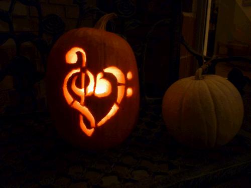 Clark's music teachers would be so proud...he obviously loves music!  Notice the cool white pumpkin on the right?