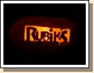 Closeup of Clark's carving of the Rubik's Magic logo.