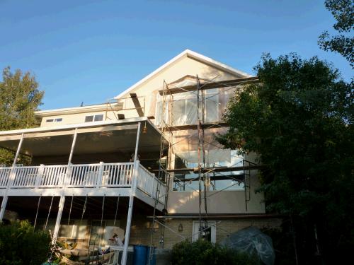 Four stories of scaffolding.  Alan took a little walk out there and decided he preferred working from a chair at a desk.  Climbing around out there didn't seem to faze the stucco guys -- of course we paid them enough they would probably be willing to stand on their heads!